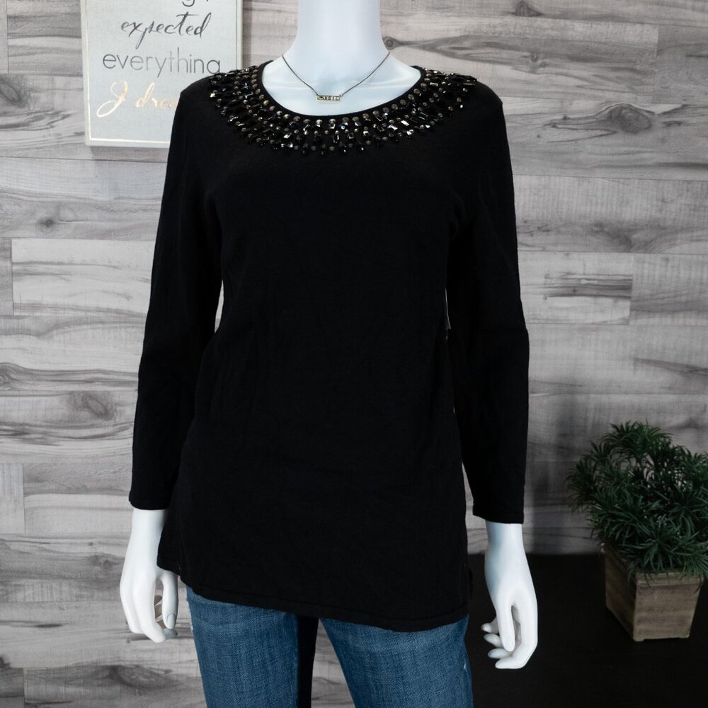 Alex Marie black sweater with black embellishments.